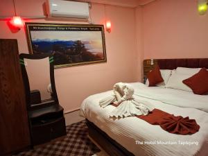 Ένα ή περισσότερα κρεβάτια σε δωμάτιο στο The hotel mountain Taplejung