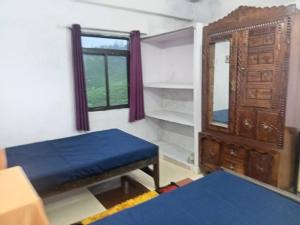 Postel nebo postele na pokoji v ubytování Ambika Villa 3 bedrooms homestay in Vagamon