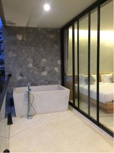 Postel nebo postele na pokoji v ubytování Botanica Khaoyai Residence