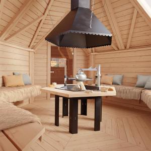a room with a table in a wooden cabin at Secret Lapland - Luxury Villa Siida with Northern Lights Hut in Pyhätunturi