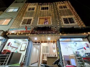 a building with lights on the front of it at Hotel star villa INN in Ujjain