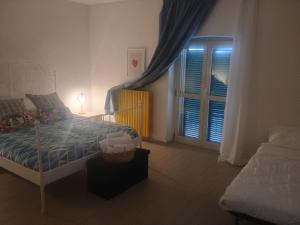 A bed or beds in a room at Terrazza Sui Sassi