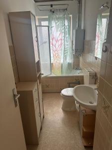 a bathroom with a toilet and a sink at Hami Apartments Hannover in Hannover