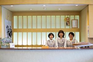 three women are standing behind a counter in a kitchen at Hotel Tango Kingdom in Kyotango +53 photos