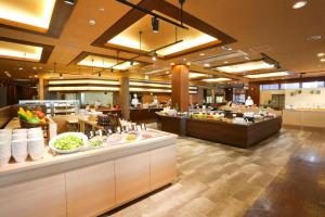 a restaurant with a buffet line with food on display at Hotel Wellseason Hamanako in Hamamatsu