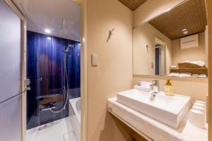 a bathroom with a sink and a shower at RESI STAY Kumico Amaterrace in Kyoto +123 photos