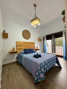 Posteľ alebo postele v izbe v ubytovaní Apartamento El Olivo Vejer