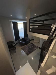 a living room with a bunk bed and a couch at SD Studio Nr Hopetown A1 A19 A66 in Darlington +5 photos