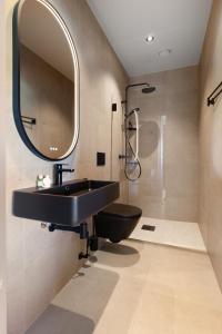 Koupelna v ubytování Bjugn Hotell