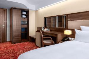 Letto o letti in una camera di Movenpick hotel Sarajevo