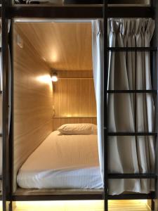 a bunk bed in a room with a bunk bed at 九窩Jiu Wow Box Inn Jiufen九份 in Jiufen