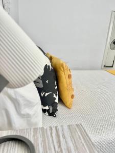 two pillows sitting on top of a bed at Imperial Villas I Mar y Playa in Puerto del Carmen