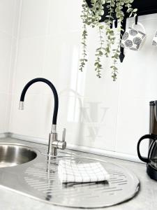 a kitchen sink with a faucet and a keyboard at Imperial Villas I Mar y Playa in Puerto del Carmen