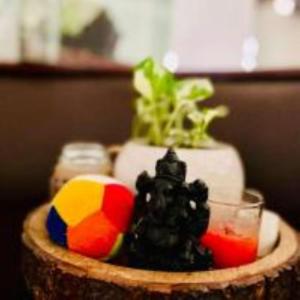 a bowl with a beach ball and a drink in it at Halcyon Homes-Trivandrum in Chacka