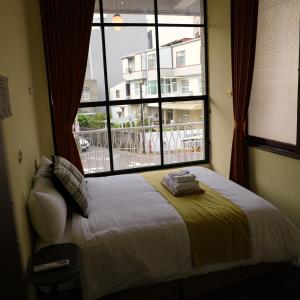 Postel nebo postele na pokoji v ubytování 包棟-事務所洋樓 The Remote Living-台南獨棟古典洋樓8-10人 停四台車