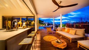 a living room with a couch and a table at The Villas by LXRYHOME in Jan Thiel