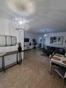 a living room with a couch and a table at Granillo Beach Calm in Costa Calma