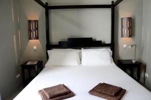 מיטה או מיטות בחדר ב-Casa Colonial