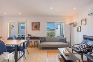 a living room with a couch and a table at CostaBlancaDreams Casa Tinick in Calpe in Empedrola