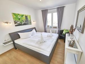 Postel nebo postele na pokoji v ubytování Wohnpark Stadt Hamburg - Apt. 50