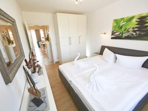 Postel nebo postele na pokoji v ubytování Wohnpark Stadt Hamburg - Apt. 50