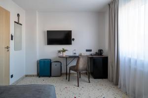 TV a/nebo společenská místnost v ubytování Antares Hotel
