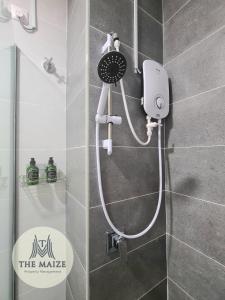 a shower with a blow dryer in a bathroom at The Cove Hillside Residence Ipoh-Nature On Earth in Ipoh