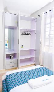 En eller flere senge i et værelse på Ravic Homes, Naivasha Town