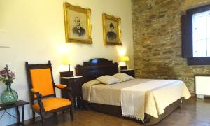 A bed or beds in a room at La Torre del Vilar
