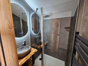 a bathroom with a sink and a mirror at Le 4 in Les Deux Alpes +57 photos