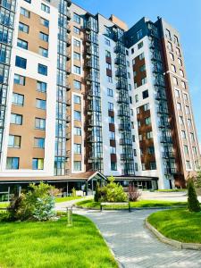 a large apartment complex with tall buildings at Designer apartments with a coffee machine in the city center in Rivne +22 photos