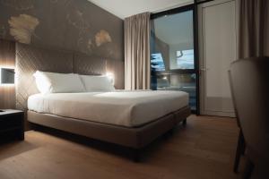 Postel nebo postele na pokoji v ubytování Hotel Pineta