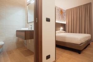 Postel nebo postele na pokoji v ubytování Hotel Pineta