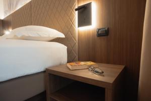 Postel nebo postele na pokoji v ubytování Hotel Pineta