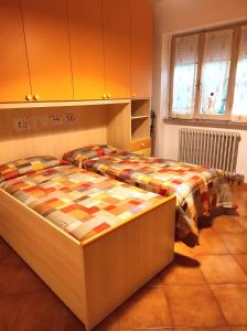 a bedroom with two beds in a room at Al Parchino in Arezzo