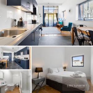 a kitchen and a living room with a bed in a room at Smythen St, 2 bed apartment with balcony in Exeter
