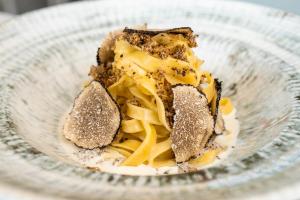 a bowl of food with pasta in it at Hotel la Palma au Lac in Locarno