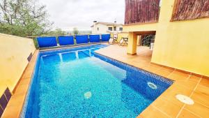 a swimming pool in the backyard of a house at L'Essència de l'Empordà -Girona-COSTA BRAVA in Verges