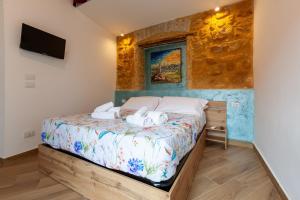 Postel nebo postele na pokoji v ubytování Pasitea Rooms