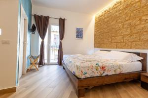 Postel nebo postele na pokoji v ubytování Pasitea Rooms