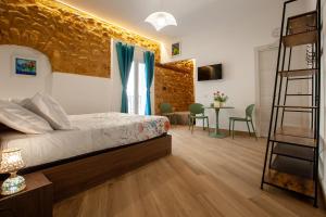 Postel nebo postele na pokoji v ubytování Pasitea Rooms