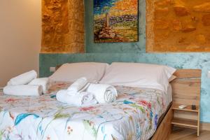Postel nebo postele na pokoji v ubytování Pasitea Rooms