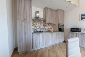 Kuchyň nebo kuchyňský kout v ubytování Pasitea Rooms