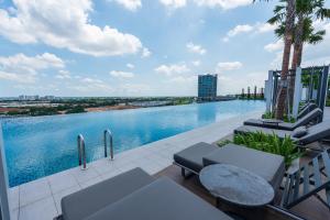 a view of a swimming pool on top of a building at Setia Alam Convention Centre 3 Bedroom 2-9Pax #33 in Shah Alam