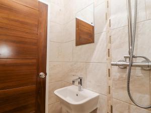 a bathroom with a sink and a shower at Heron in St Ives +17 photos