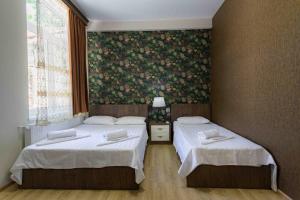 Postel nebo postele na pokoji v ubytování Urban Villa By Umbrella