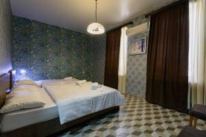 Postel nebo postele na pokoji v ubytování Urban Villa By Umbrella