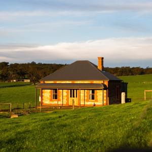 a house in the middle of a field at The Old Farm Cottage, Mount Torrens in Mount Torrens