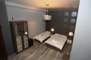 Postel nebo postele na pokoji v ubytování Urban Villa By Umbrella