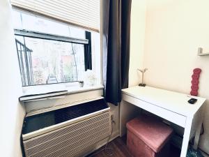 a room with a window and a desk and a windowpectpect at UES Manhattan ROOM #2 in Shared Apartment in New York